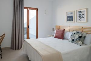 Postel nebo postele na pokoji v ubytování Villas Altos de Lanzarote