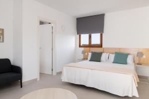 Postel nebo postele na pokoji v ubytování Villas Altos de Lanzarote