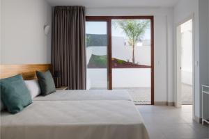 Postel nebo postele na pokoji v ubytování Villas Altos de Lanzarote