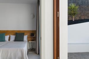 Postel nebo postele na pokoji v ubytování Villas Altos de Lanzarote