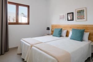 Postel nebo postele na pokoji v ubytování Villas Altos de Lanzarote