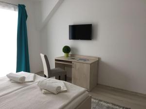 Μια τηλεόραση ή/και κέντρο ψυχαγωγίας στο Hotel Aqua