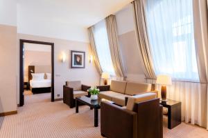 Uma área de estar em Hotel Polonia Palace