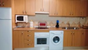 Kuchyň nebo kuchyňský kout v ubytování Apartamento Rural Forest Home