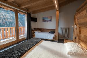 Posteľ alebo postele v izbe v ubytovaní Albergo Alpino