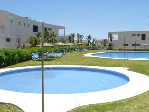 Der Swimmingpool an oder in der Nähe von Fine Duplex Apartment with Stunning Sea Views