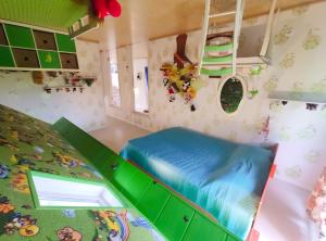 a room with a bed and a bunk bed in a room at Night in Upsidedown House in Petrovo