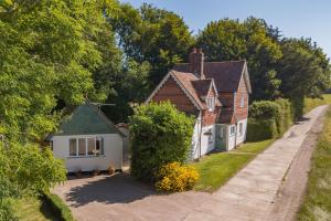 a group of houses on the side of a road at Pheasants Lodge by Bloom Stays in Canterbury