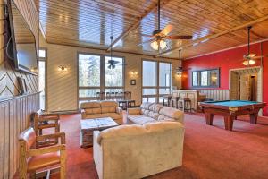 a living room with couches and a pool table at Brian Head Condo Near Lifts at Giant Steps! in Brian Head