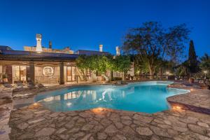 a swimming pool in a yard with a house at Masseria Zanzara in Porto Cesareo