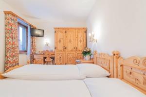 Postel nebo postele na pokoji v ubytování Hotel Corvatsch - Web Check-in + 17 fotografií