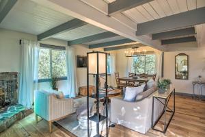 a living room with chairs and a table at Modern Groveland Chalet about 25 Mi to Yosemite! in Groveland