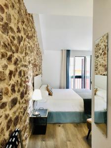 Postel nebo postele na pokoji v ubytování Soléa House Hotel Boutique