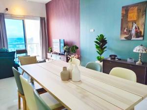 a dining room with a large table and chairs at No.15 Eighties 80's @ Retro interior near Sunway in Puchong