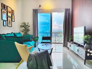 a living room with a green couch and a table at No.15 Eighties 80's @ Retro interior near Sunway in Puchong