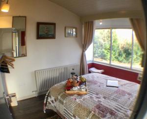 Postel nebo postele na pokoji v ubytování Rodeen Country House