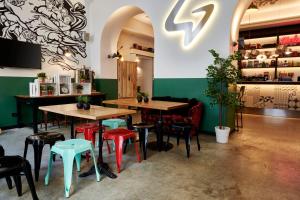 a restaurant with tables and chairs in it at Generator Rome in Rome