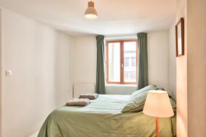 En eller flere senge i et værelse på La maison du pêcheur