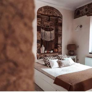 Ένα ή περισσότερα κρεβάτια σε δωμάτιο στο Frourio Apartments