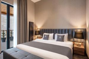 Ένα ή περισσότερα κρεβάτια σε δωμάτιο στο Bristol Hotel and Spa Bakuriani