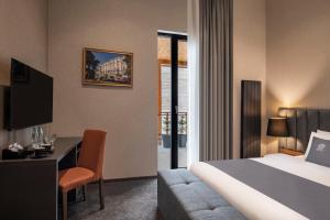 Ένα ή περισσότερα κρεβάτια σε δωμάτιο στο Bristol Hotel and Spa Bakuriani