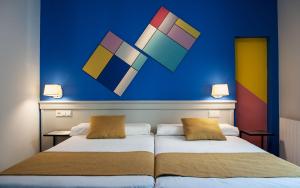 Posteľ alebo postele v izbe v ubytovaní Hotel Hito