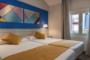Posteľ alebo postele v izbe v ubytovaní Hotel Hito