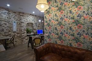 TV a/nebo společenská místnost v ubytování Soléa House Hotel Boutique