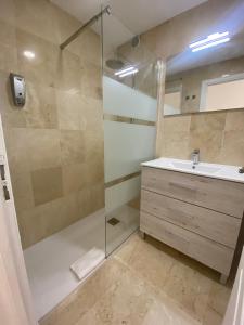 a bathroom with a shower and a sink at Caleta Sunset in Caleta De Fuste +29 photos