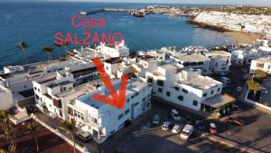 a large building with a clock on top of it at Casa salzano in Playa Blanca