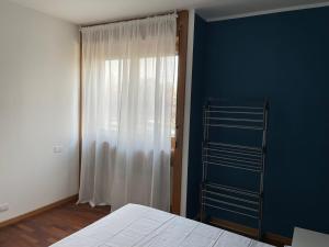 Кровать или кровати в номере BICOCCA APARTMENT