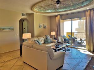 a living room with a couch and a table at Bella Sirena 601-D in Puerto Peñasco