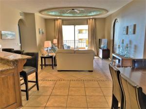 a living room with a couch and a table at Bella Sirena 601-D in Puerto Peñasco