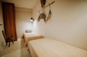 Ein Bett oder Betten in einem Zimmer der Unterkunft Eco-lodge Villa Epicurea