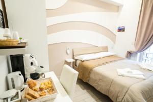 A bed or beds in a room at Terrazza Garibaldi