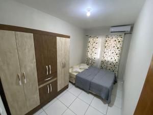 Cama o camas de una habitación en Casa Geminada em Zimbros