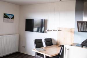 TV a/nebo společenská místnost v ubytování Limbach