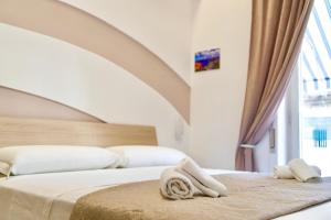A bed or beds in a room at Terrazza Garibaldi