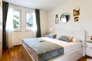 Postel nebo postele na pokoji v ubytování Green 'n Grey Omiš