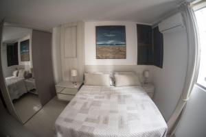 En eller flere senge i et værelse på Flat Cabo Branco - Alto Padrao + 18 billeder