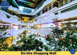 an on site shopping mall with trees and lights at Revo Home at Pavilion Bukit Jalil in Kuala Lumpur