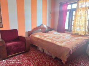 Postel nebo postele na pokoji v ubytování Al Amin Homestay