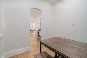 a dining room with a table and a kitchen at Plush 2-bed apt in Riverside Heights! in Reno +14 photos