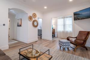 a living room with a couch and a chair at Plush 2-bed apt in Riverside Heights! in Reno