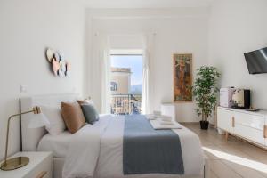 Voodi või voodid majutusasutuse Naro Suites and Rooms toas