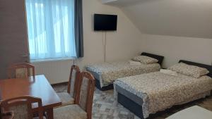 Una cama o camas en una habitación de Apartments Tatic