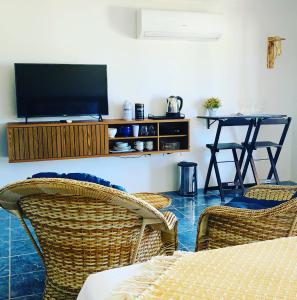 TV a/nebo společenská místnost v ubytování Suíte frente mar e pés na areia