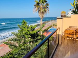 a balcony with a view of the ocean at OvertheOcean Big terrace and XL Bed in Cabo Verde