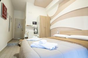 A bed or beds in a room at Terrazza Garibaldi