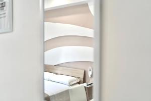 A bed or beds in a room at Terrazza Garibaldi